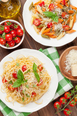 Spaghetti and penne pasta with tomatoes and basil