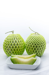 Green cantaloupe melon on white background