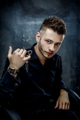 Elegant young handsome man. Studio fashion portrait.Portrait of a young brutal man with straight razor