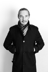 Close-up studio portrait of young Asian man