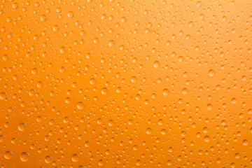 water drop on orange background