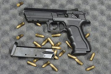 ammunition (bullets) and pistol with the weapon holder