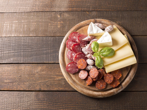 Fototapeta top view of appetizer with sausages and cheese