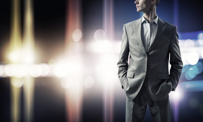 Confident businessman in bokeh lights