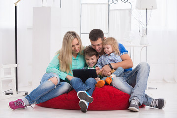 happy family uses a tablet