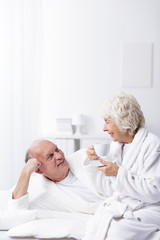 Fototapeta premium Elderly married couple in bed