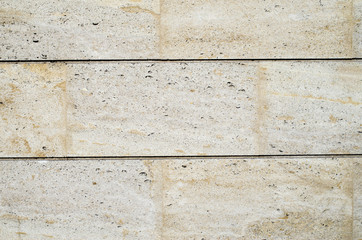 New stone cladding plates on the wall