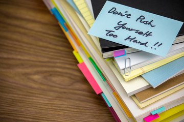 Don't Work Too Hard; The Pile of Business Documents on the Desk