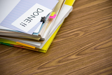 Done; The Pile of Business Documents on the Desk
