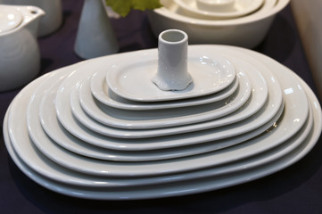 Fototapeta na wymiar White set of porcelain plates 