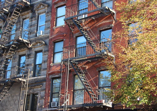 Perspective of Fire Escape Ladders on Apartment Building Block