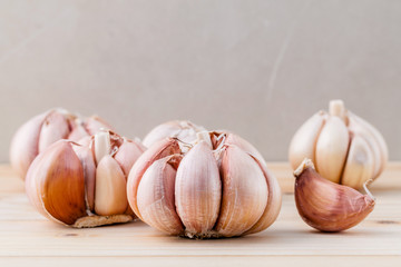 Close Up organic garlic with selective focus on the teak wood ba