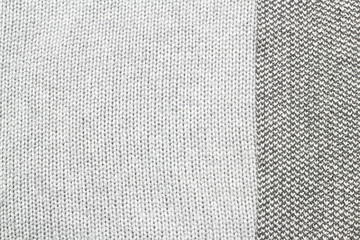 Grey knitted fabric made of heathered yarn background / texture