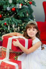 Obraz na płótnie Canvas girl with gifts for the Christmas
