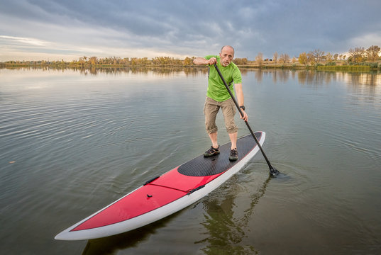 male paddler on stand up paddleboard