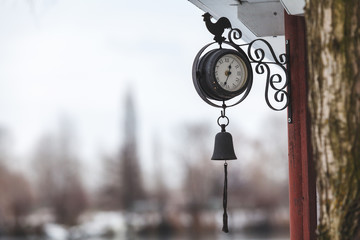 Street round clock with bell and rooster