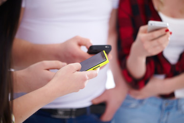 group of young people with phones