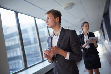 business woman with tablet and businessman with telephone