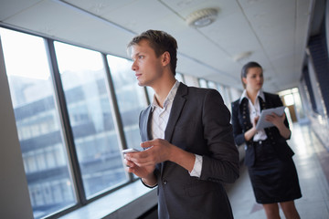 business woman with tablet and businessman with telephone