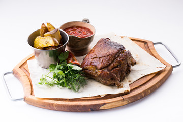 roasted pork knuckle with potatoes with sauce