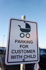 A sign for customer with child parking