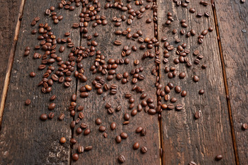 coffee beans scattered on the wooden table