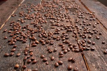 coffee beans scattered on the wooden table
