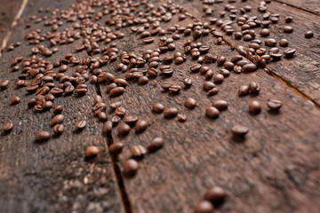 coffee beans scattered on the wooden table