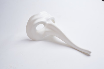 white venetian mask on a white background