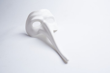white venetian mask on a white background