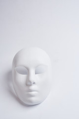 white venetian mask on a white background