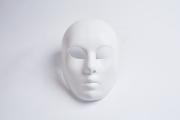 white venetian mask on a white background