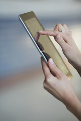 tablet in female hands closeup