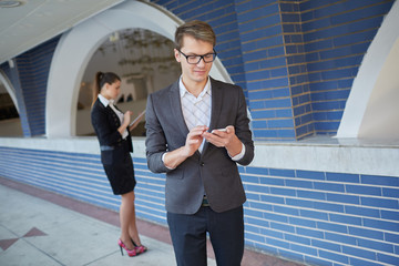 business woman with tablet and businessman with telephone