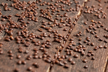 coffee beans scattered on the wooden table