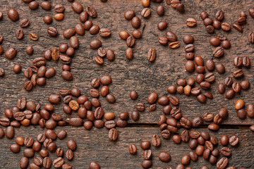 coffee beans scattered on the wooden table