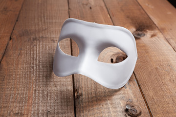 White Venetian mask on the table