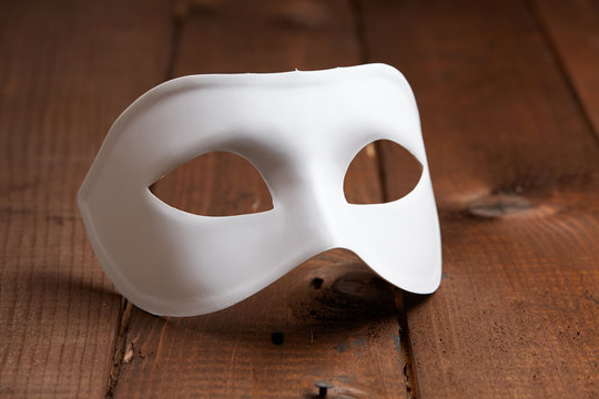 White Venetian mask on the table