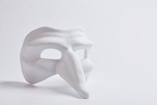 white venetian mask on a white background