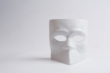 white venetian mask on a white background