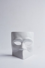 white venetian mask on a white background