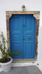 Fototapeta na wymiar door in small greece village exo gonia on santorini