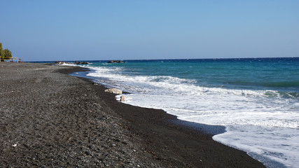 Fototapeta na wymiar volcanic beach in kamari on santorini siland