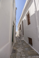 Small alleyway between white houses on Naxos