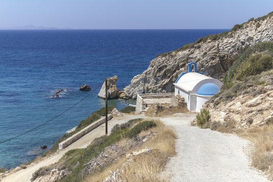 White chapel at bay on Naxos, Greece