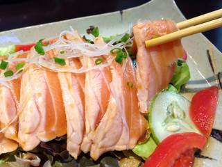 Diet manu by salmon sashimi on the white dish