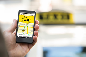 Person Booking Taxi On Smart Phone