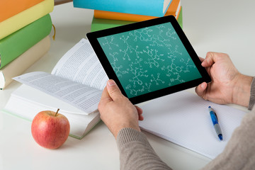Student Learning Chemical Formulas On Digital Tablet
