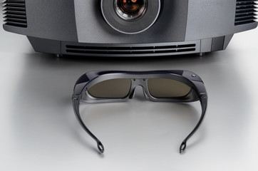Front view of a home cinema projector with 3D-glasses
