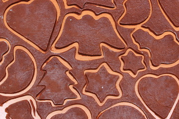 Dough for gingerbread in shape of heart, star and christmas tree